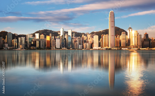 Hong Kong at sunrise with reflection, Financial downtow with skyscrapers photo