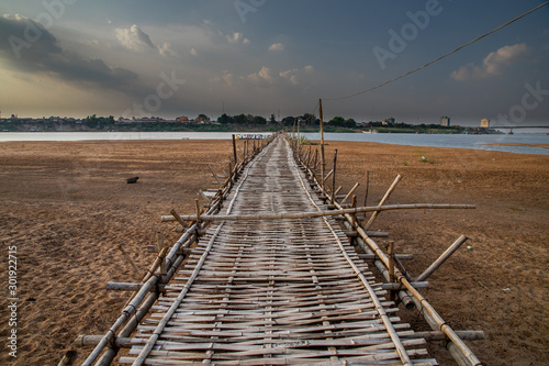 old traditional bamboo wooden bridge across Mekong river  from Koh Paen island to Kampong Cham   Cambodia