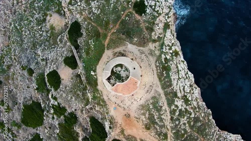Top View Of The Alcaufar Defense Tower In Menorca, Morro d'Alcaufar, Spain During Daylight - Aerial Shot photo