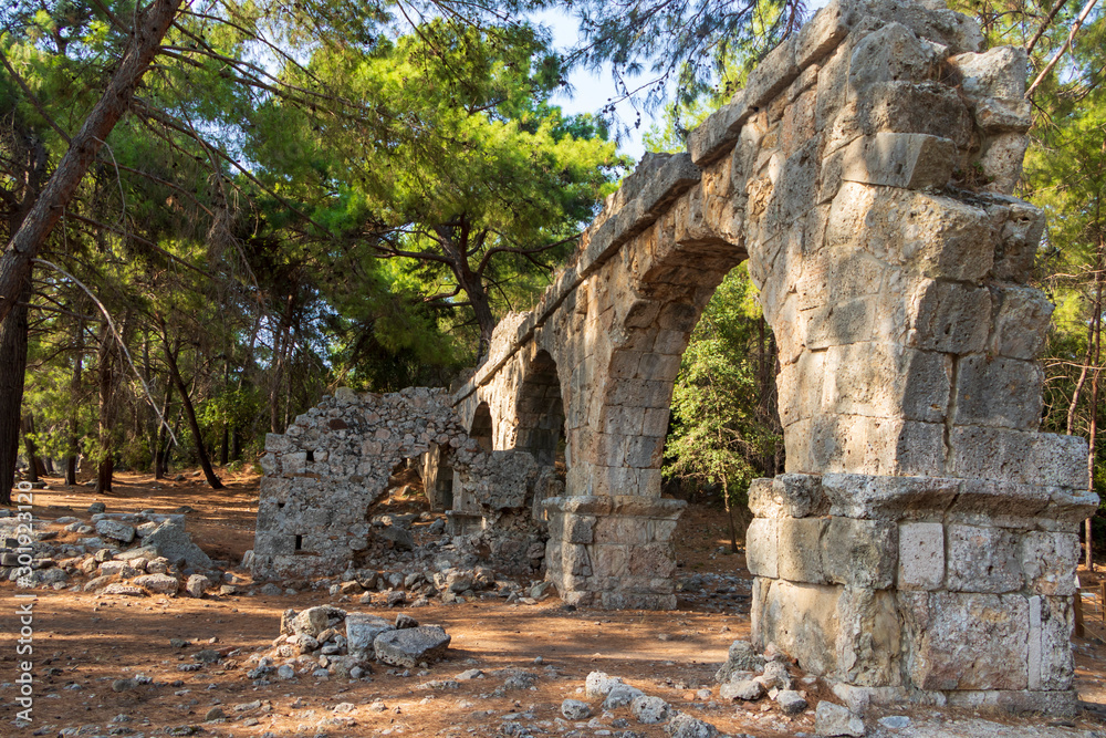 The ruined aqueduct at the antique Roman port-town of Phaselis. Ancient Phaselis ruins in Turkey.  Antalya-Kemer
