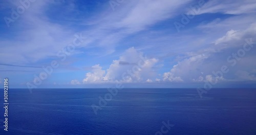 Wallpaper Mural Bright blue colors of picturesque seascape with beautiful veil of clouds hanging over navy blue ocean, copy space Torontodigital.ca