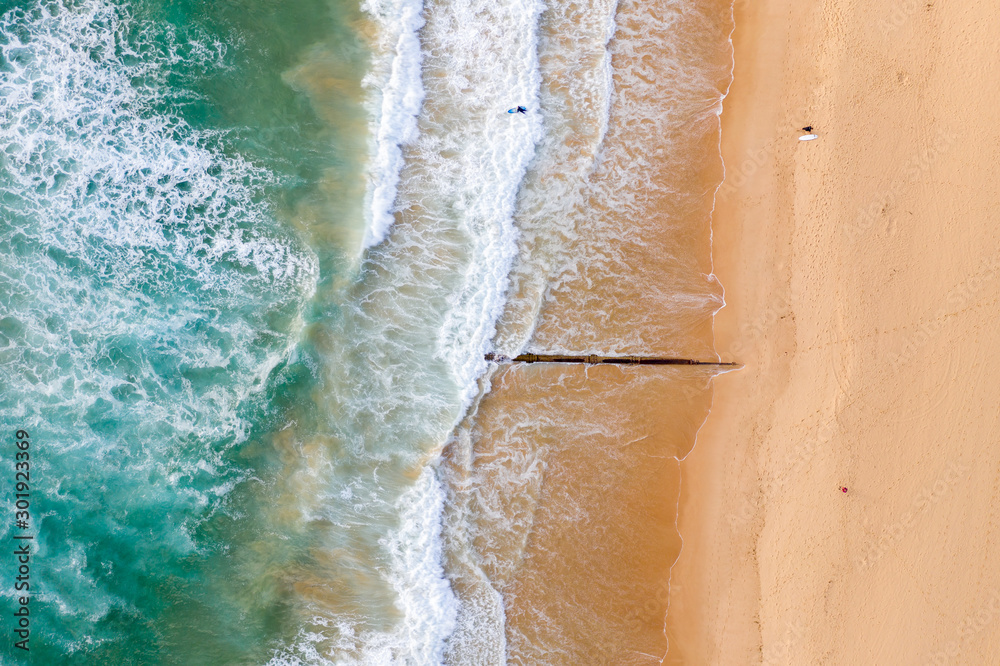 Aerial view of beach with surfers Aerial view of beach with surfers