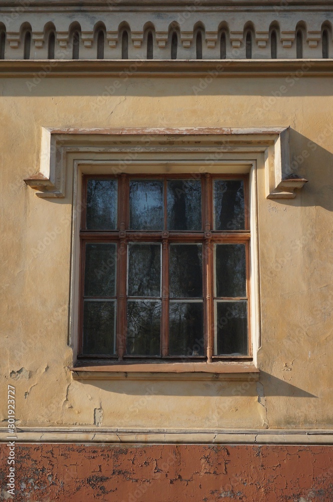 Old window in the wall on a 19th-century estate,