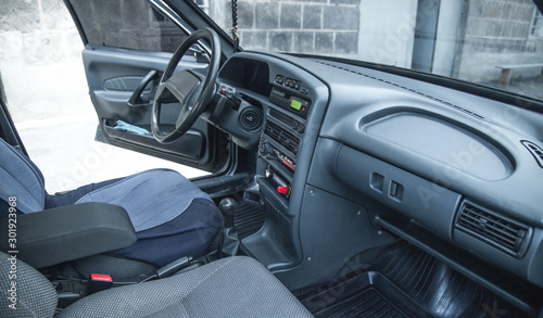 Fototapeta Naklejka Na Ścianę i Meble -  Dark interior of car. Steering wheel, Dashboard