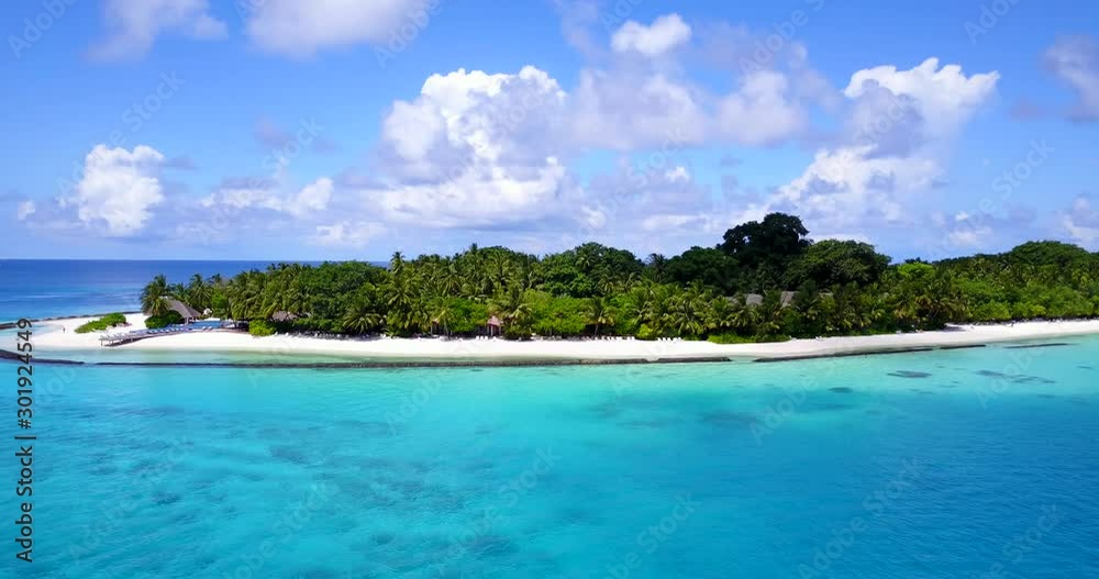 Bright seascape with vivid colors of beautiful sky and blue turquoise lagoon surrounding tropical island in Hawaii Bright seascape with vivid colors of beautiful sky and blue turquoise lagoon surrounding tropical island in Hawaii