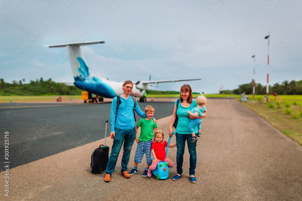 happy family with kids enjoy travel by plane, vacation concept happy family with kids enjoy travel by plane, vacation concept