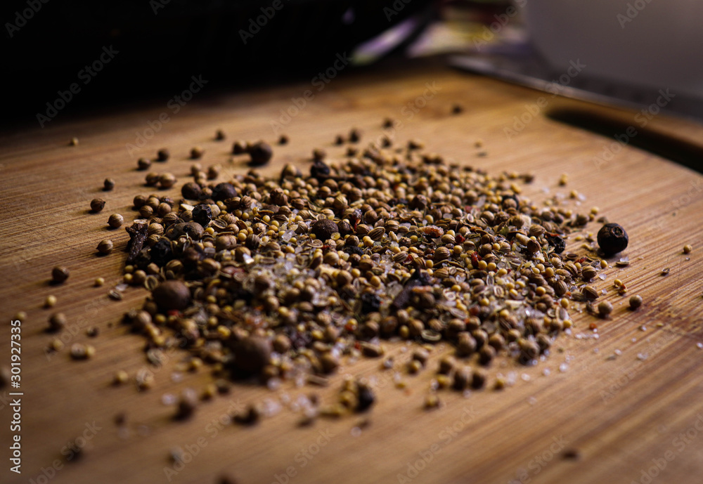 Closeup spice mix: salt, pepper, mustard, cloves. Can be used for harvesting homemade canned goods. - obrazy, fototapety, plakaty 