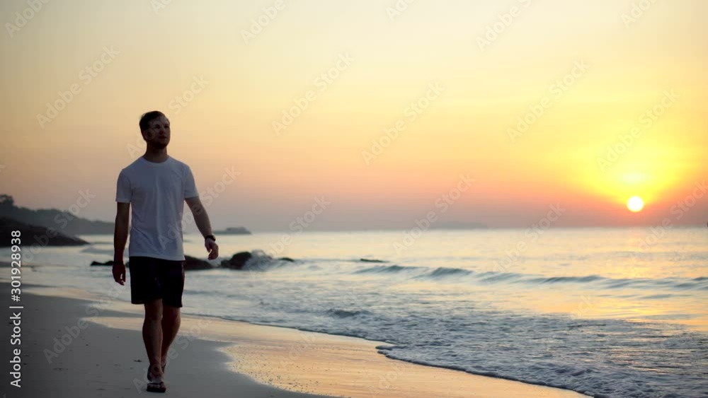 Digital Nomad or Freelancing Expat With Alternative Lifestyle Walking on Tropical Beach of Exotic Country During Sunrise