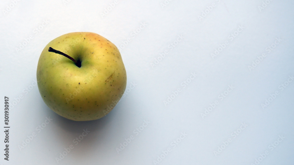 Organic yellow apple on a white background Organic yellow apple on a white background