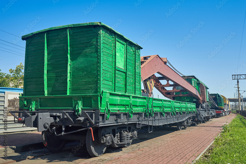 Old railway crane at the station near the platform Old railway crane at the station near the platform