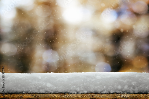 a winter Christmas background with snow on the wood