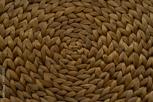 Light brown handicraft weave texture wicker surface for furniture material. Background pattern.