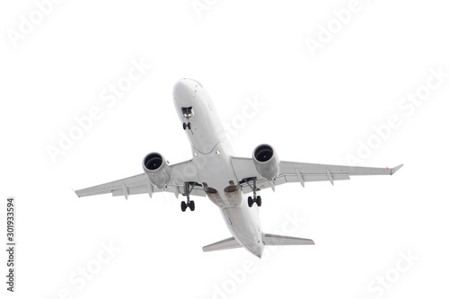white passenger plane has released its landing gear and is landing isolated on white background with cliping path