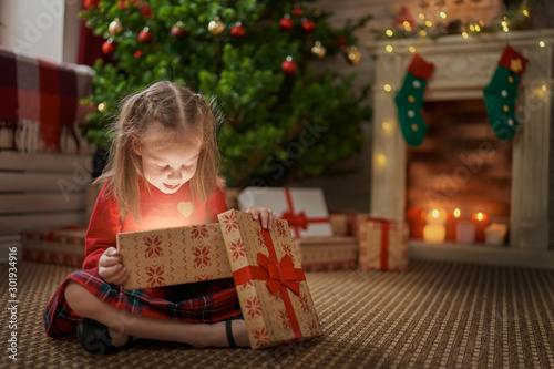 girl with present at Christmas