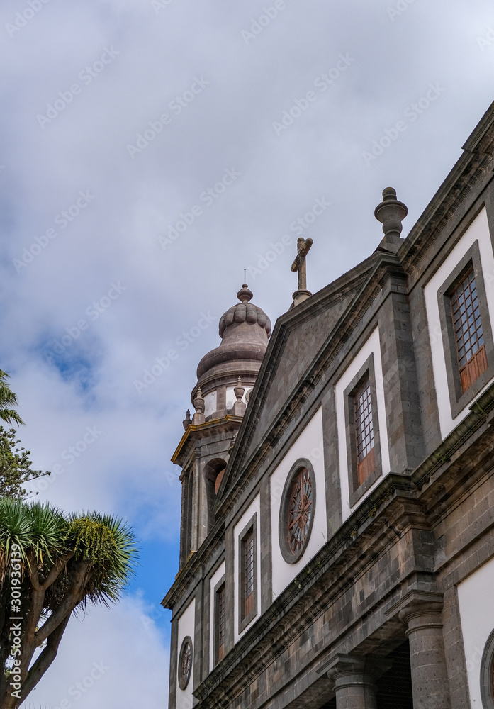 San Cristobal de La Laguna, Tenerife, Spain. Antique style building on a cloudy blue sky background. Colonial style of the city. Houses painted with various bright colors.