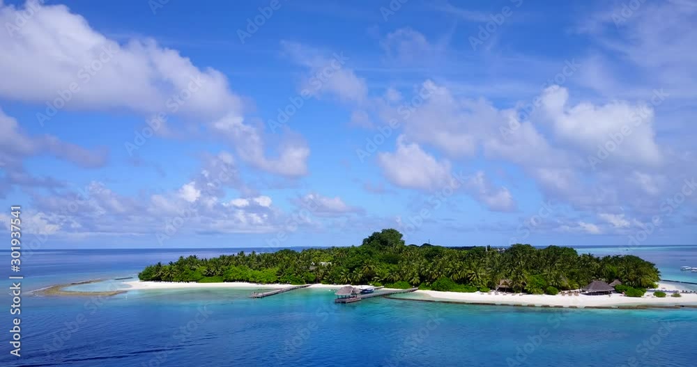Wonderful View of Green Island In a Stunning location Surrounded By Blue Clean Water in the Maldives - Aerial shot Wonderful View of Green Island In a Stunning location Surrounded By Blue Clean Water in the Maldives - Aerial shot