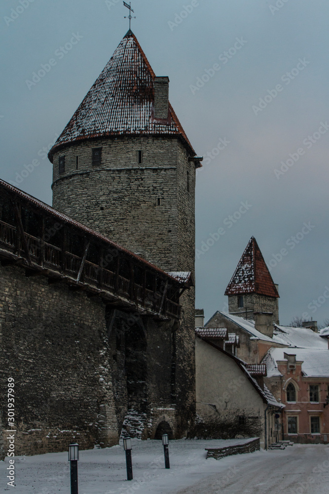 Fototapeta premium Historic tower defense tower in Old Town in winter. Estonia