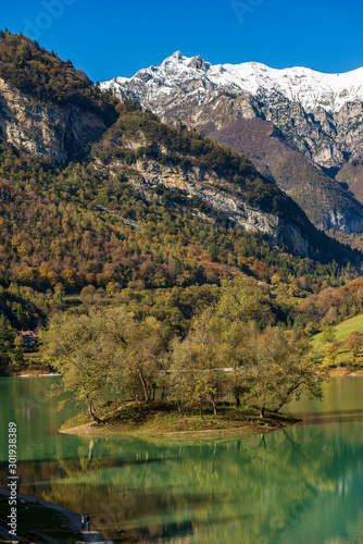Lago di Tenno  small and beautiful lake in Italian alps with an island. Trento province  Trentino-Alto Adige  Italy  Europe
