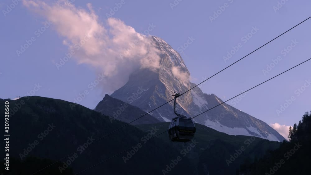 a timelapse in the evening with a gondola in front of the famous Matterhorn in Zermatt in Switzerland