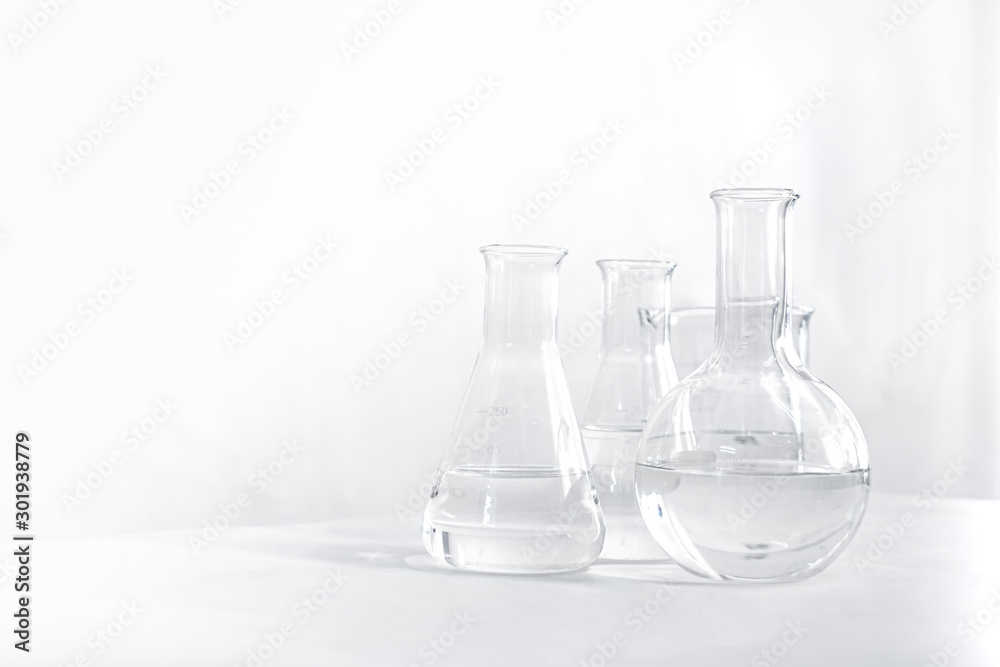Science laboratory chemical beaker, Erlenmeyer and round flask lab glassware equipment. Research and development concept. Science laboratory chemical beaker, Erlenmeyer and round flask lab glassware equipment. Research and development concept.
