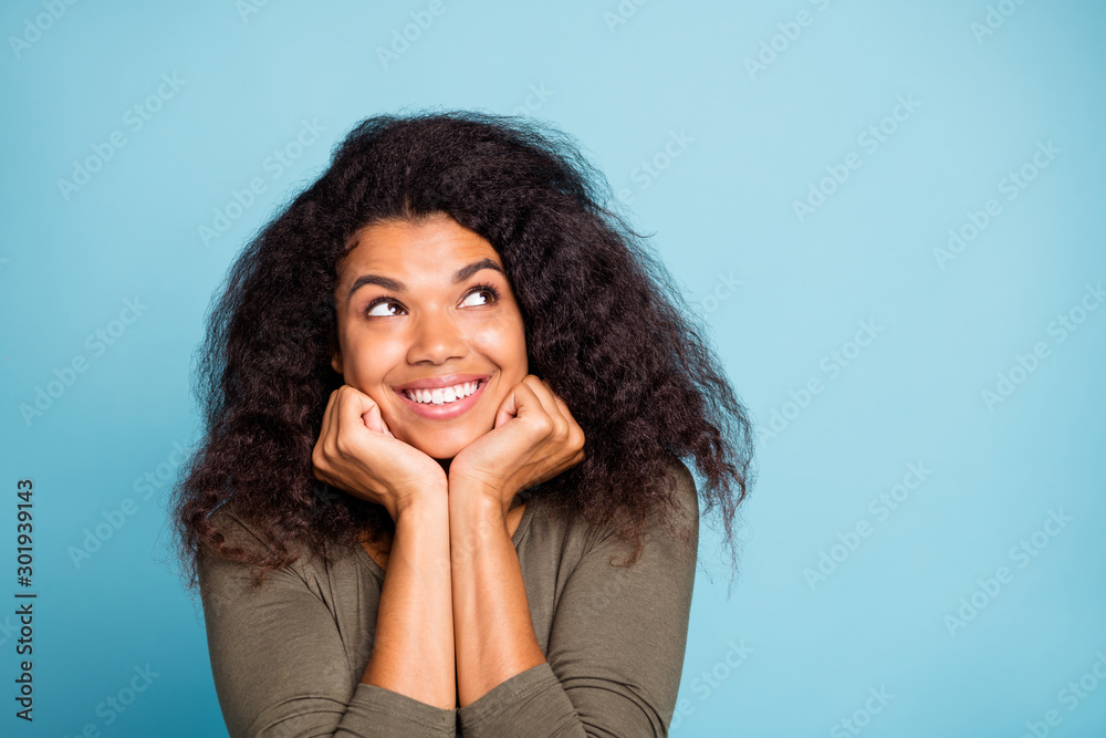 Close up photo of interested positive girl think dream about her wonderful holidays weekends wear green casual style outfit isolated over blue color background Close up photo of interested positive girl think dream about her wonderful holidays weekends wear green casual style outfit isolated over blue color background