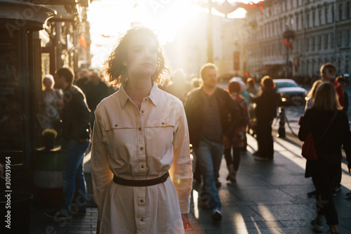 Street city sunny portrait of happy  young woman