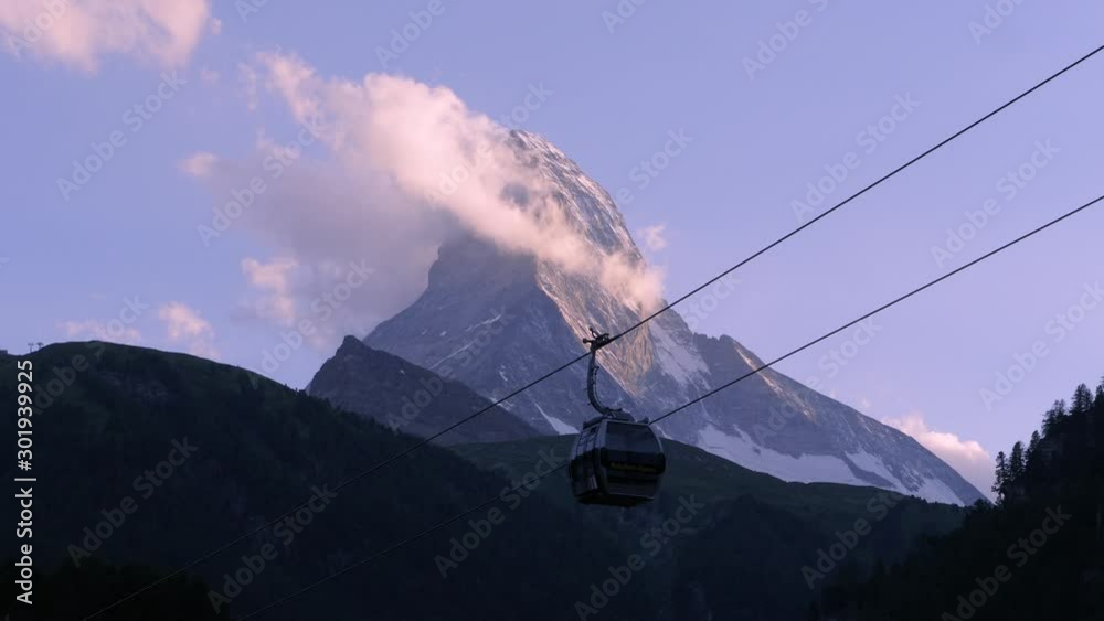 a timelapse in the evening with a gondola in front of the famous Matterhorn in Zermatt in Switzerland