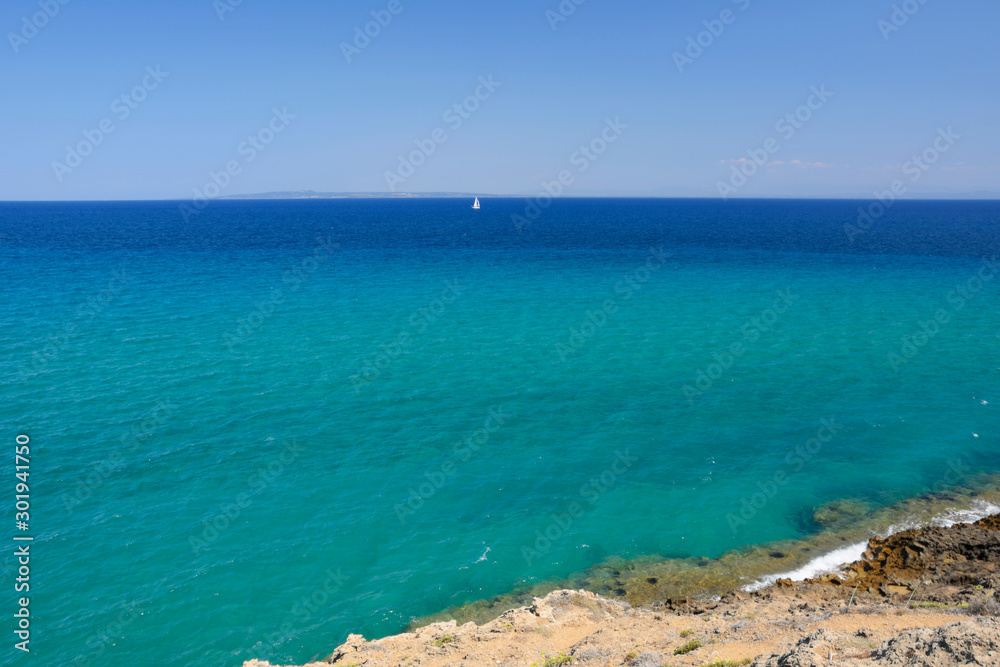 white sailboat on the horizon - Ionian Sea, Zakynthos (Greece) white sailboat on the horizon - Ionian Sea, Zakynthos (Greece)