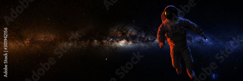 astronaut in front of the Milky Way galax