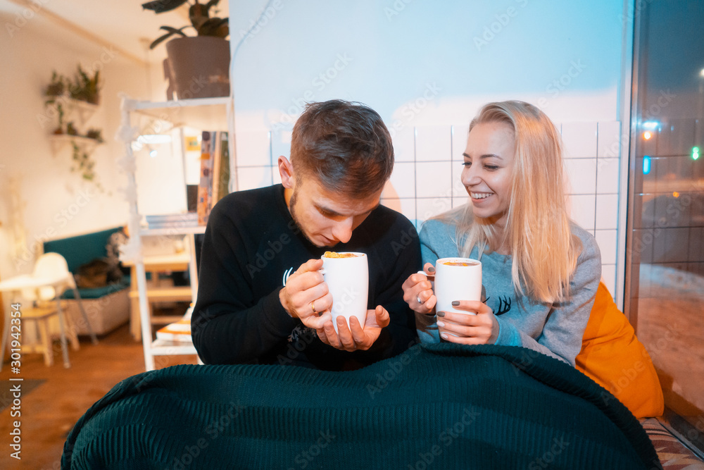 guy with a girl drink hot coffee and tea