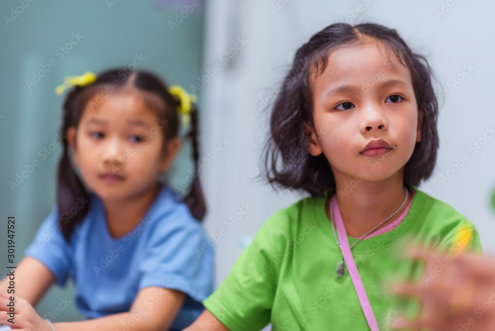 Asian elementary school girls are studying in the classroom. Asian elementary school girls are studying in the classroom.