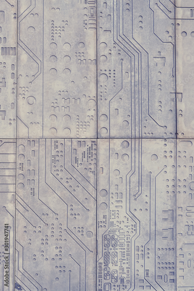 The texture of a stone wall with a carved pattern of a digital computer ...