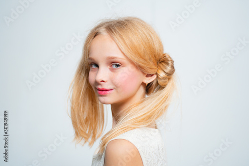 Wintage teen style. Happy blond teenager girl. Skincare and natural makeup for retro blonde teen. Beauty hairdresser salon. Healthy long hair with natural color