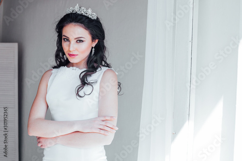 Portrait of bride wedding dress Crown hairstyle photo