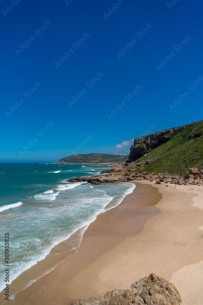 Beautiful tropical beach background with mountains and sandy shore