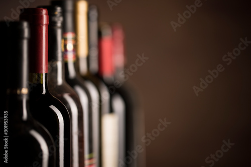 Wine bottles collection on a dark background