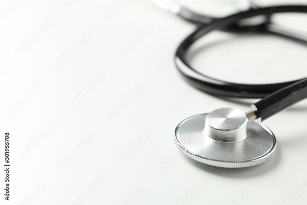 Black stethoscope on white background, close up. Healthcare Black stethoscope on white background, close up. Healthcare