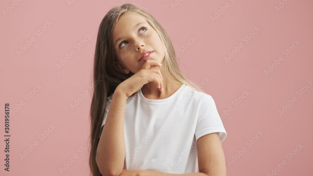 Pensive little girl thinking and making idea gesture over pink background isolated Pensive little girl thinking and making idea gesture over pink background isolated