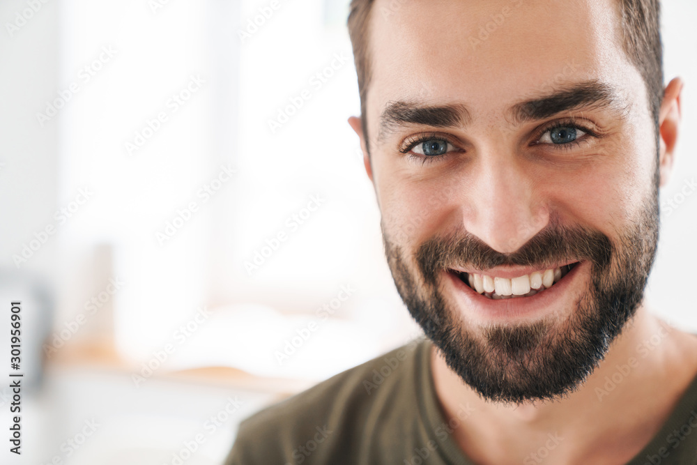 Image closeup of caucasian happy man looking and smiling at camera