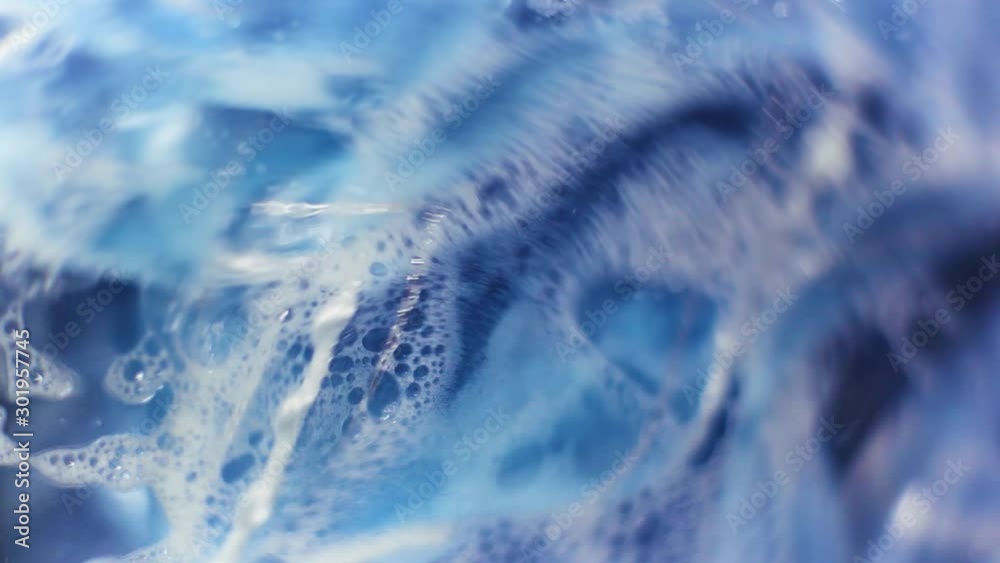 The washing machine washes things. Wet things in the foam and water spin in the washing machine.