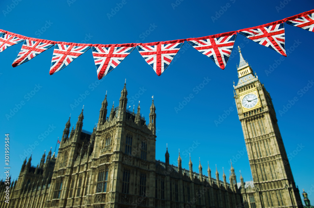 Φωτογραφία Vintage British Union Jack flag bunting hanging in front of the Houses of Parlia