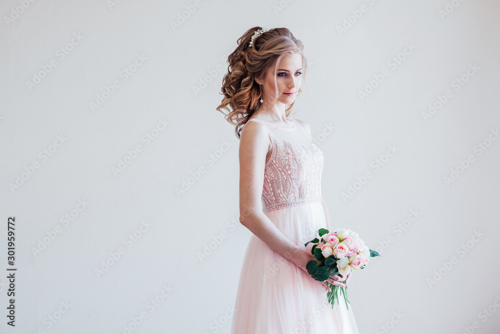 bride in a pink wedding dress and bouquet of flowers bride in a pink wedding dress and bouquet of flowers