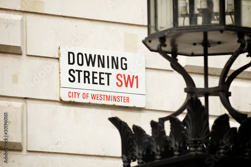 Downing Street sign in the political center of Westminster, London photo