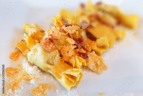 Traditional Casoncelli alla Bergamasca on the plate. Traditional stuffed pasta from the Northern Italian town of Bergamo! photo