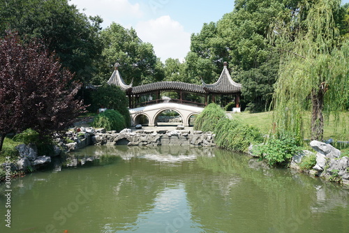 Suzhou,China-September 17, 2019: A pond and a garden in Nan Men, Suzhou, China photo