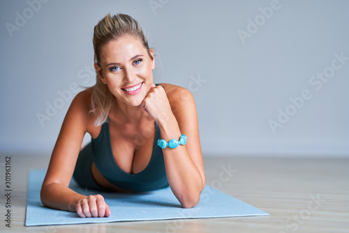 Adult woman practising yoga at home