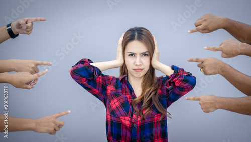 Blaming you. Anxious surprised woman being judged by different people pointing fingers at her. Negative human emotions feeling photo
