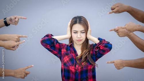 Blaming you. Anxious surprised woman being judged by different people pointing fingers at her. Negative human emotions feeling photo