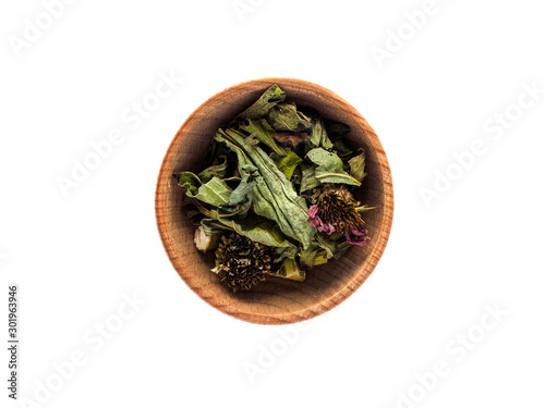 Dry Echinacea purpurea in a wooden Cup on a white background