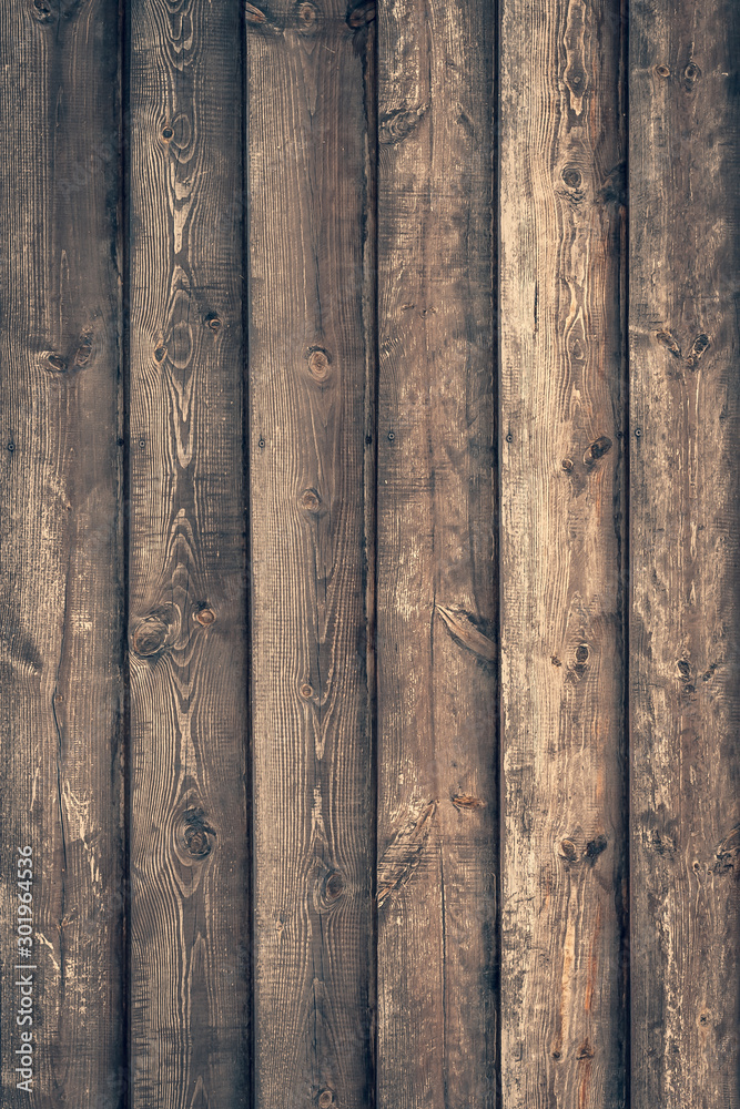 Dark old timber planks. Dirty brown fence. Wooden rough surface. Dark board pattern, grunge fence. Hardwood natural background. Wood material, texture.